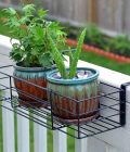 Adjustable Flower Pot Rack Holder Plant Stand - Expands 14"-27" to accomodate Multiple flowerpots, Hanger Hooks fit Almost Any Balcony, Fence or Deck Railing up to 6" Wide - Steel Black